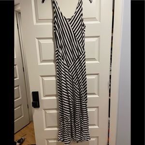 White and black dress. Hugs body and flares at the bottom